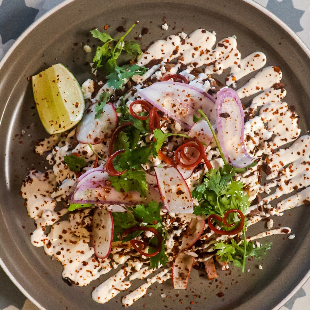 Expect the unexpected here at LimeHoney. You may have had stacked enchiladas before, but they were NOTHING like these. Our Stacked Smoked Brisket Enchiladas feature chopped smoked brisket, spicy red sauce, queso fresco, corn tortilla, radish, cilantr